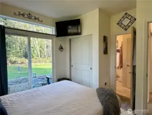 Primary with access to backyard.