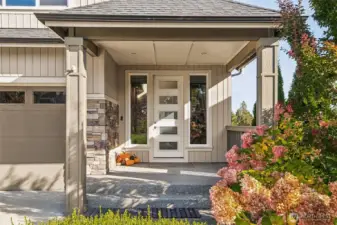 Inviting covered front porch with stone accents and a welcoming entry!