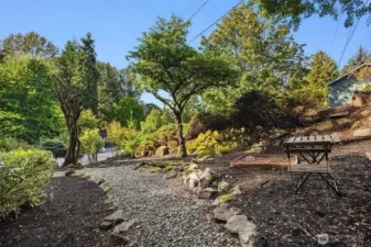 Front yard sets the house away from street - serene and private. Ready for gardening.