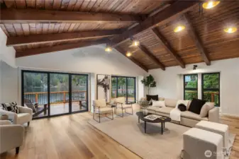 Stunning living room with wall to wall lake views