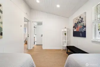 Guest bedroom can connect to the primary suite, laundry room and bathroom.