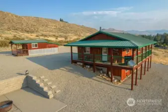 Low maintenance and gravel driveway and parking surround cabin.