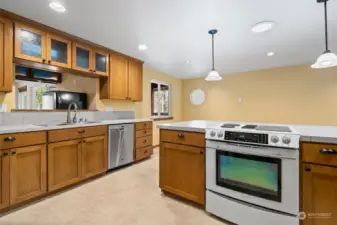 Recessed lighting provides ample lighting to the Kitchen with pending lighting above the island.