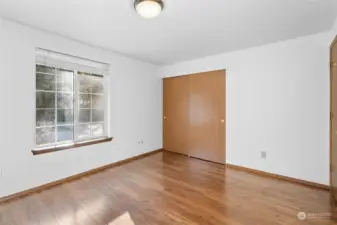 Another view of the second guest bedroom showing the double door closet.