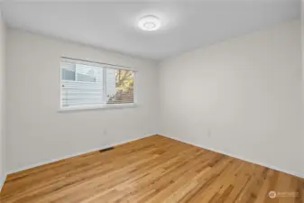 Hardwood floors continue through each of the main floor bedrooms.