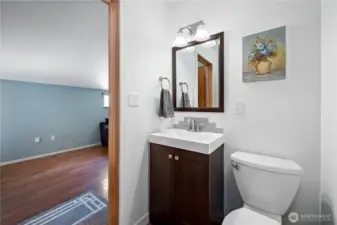 Half bath between the bonus room and the formal dining area