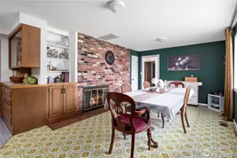 Formal dining with fireplace off of the kitchen