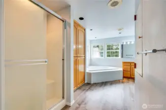 Shower and large linen/storage closet.  Even a laundry chute.
