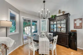 Eating nook off kitchen leading to covered back patio.