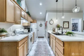 Plenty of storage in this kitchen: offering a pantry, new sink/faucet, flooring, hood and dishwasher.