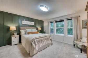Primary suite with custom designed wall, new carpet, paint and lighting.