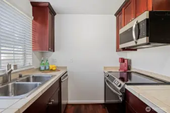 Modern kitchen with stainless steel appliances.