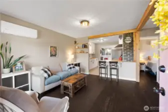 Original wood floors and exposed brick keeping the charm of age of the home.