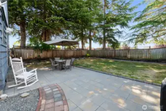 Fully fenced in back yard with nice shade
