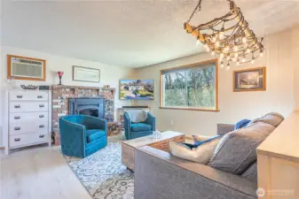 split level entry.  Step up to this beautiful living room with wood burning fireplace!
