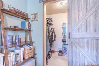 larger upstairs bedroom with barn door