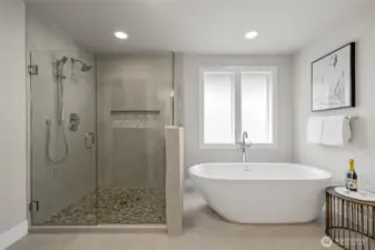 Spa-like primary bath with large shower and freestanding tub.