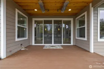Covered patio with built-in ceiling heater for year-round enjoyment.