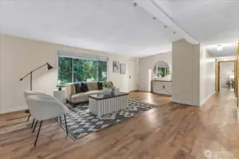The living room leads to the dining room and kitchen.