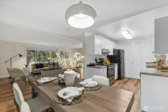 The living room leads to the dining room and kitchen and living room.