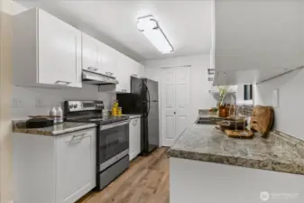 Kitchen with updated appliances and cabinets.