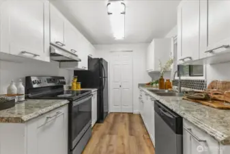 Kitchen with updated appliances and cabinets.