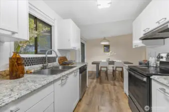 Kitchen with updated appliances and cabinets.