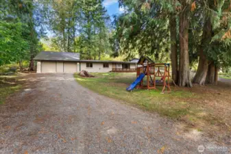 Long driveway with plenty of room for all of your toys and even an RV.
