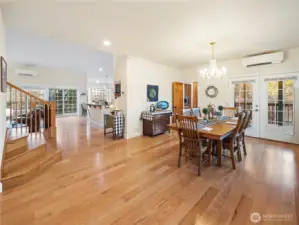 Front entry w/ adjacent dining area.