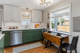Charming dining nook just off the kitchen,  filled with natural light and a cozy space for  everyday meals.