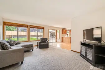 COMFORTABLE AND OPEN FAMILY ROOM WITH EASY ACCESS TO BACK DECK AND KITCHEN.