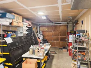 Garage with laundry and storage.