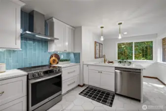 The completely remodeled kitchen features an eat in nook, perfect for a banquette table.