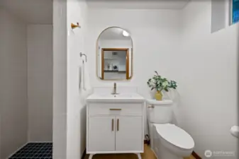 A third bathroom is located downstairs.