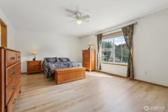 Spacious Primary Bedroom with large windows for natural light and ensuite