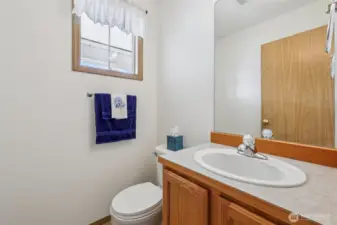 Lower Level quarter bathroom right off the front door entrance.