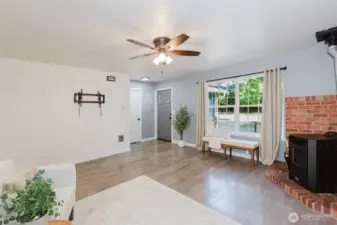 Light filled living room with cozy pellet stove