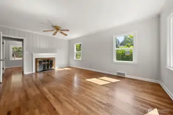 Living Room as shown today. The oak hardwood floors were protected for decades, now beautifully stained!  The home has been freshly painted both the interior and exterior;  Benjamin Moore and Sherwin Williams, high quality paint.
