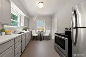 Create delicious meals and fun conversations in this updated kitchen! Enjoy the following new additions; beautiful quartz countertop, deep, stainless sink with satin finish faucet fixture, lighting over the sink and flooring.