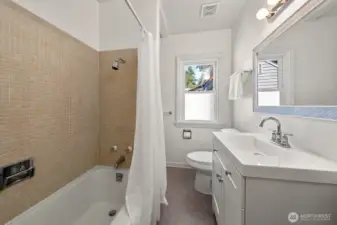 Refreshed! New vanity, toilet, faucet fixtures, lighting, flooring and mirror.