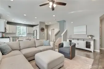 Family room view to entry, powder room inside your front door to your left. You will notice all of the additional recessed lighting that was installed throughout this home.