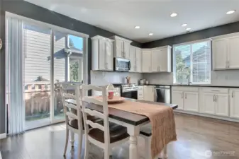 View of dining and kitchen.