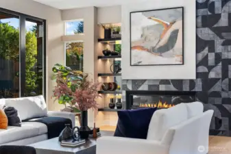 Floating shelves with integrated downlighting showcases thoughtful design and modern style.