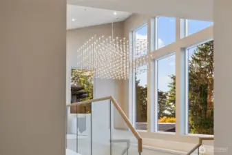 A wall of windows floods the home with natural light.
