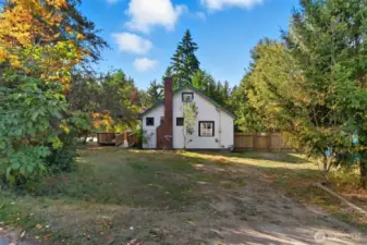 Showing extra parking entrance from the street into the side yard