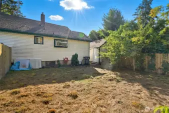 Fenced back yard is a blank slate for your vision