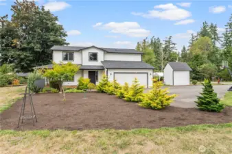 Stunning home with landscaped gardens and large driveway.