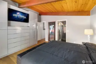 Primary Bedroom with a wall of closets and drawers