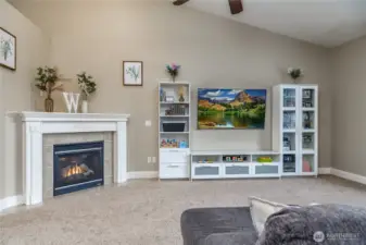 Vaulted ceiling and a gorgeous corner gas fireplace