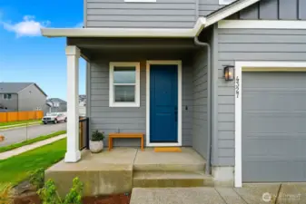 Covered porch. Front door.
